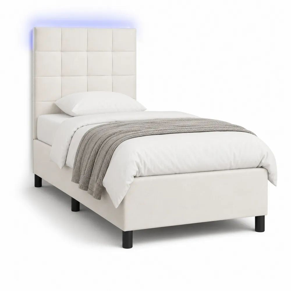 Lit simple rembourré 90 x 190 cm en similicuir crème avec tête de lit quadrillée et pieds noirs